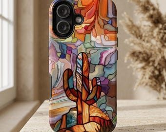 May include: A phone case featuring a stained glass style design of a saguaro cactus in shades of orange, brown, and red, set against a multicolored abstract background of interlocking shapes in blue, purple, yellow, and orange tones.
