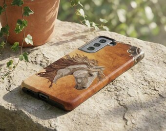 May include: A brown phone case featuring a detailed illustration of a horse's head with flowing mane. The case has a textured, wood-like appearance and a decorative corner design. The phone case is lying on a stone surface.