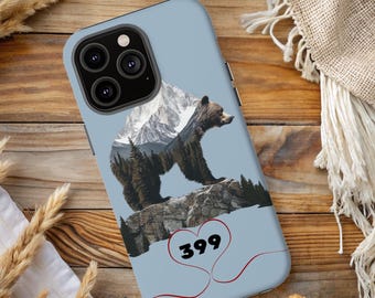 May include: A blue phone case with a brown bear standing on a mountain with a red heart and the number 399 inside.