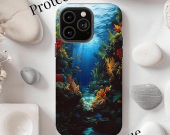 May include: A phone case with a colorful underwater scene featuring coral reefs, fish, and a blue background. The case has a cutout for the camera lens.