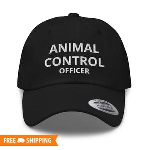 May include: Black baseball cap with white embroidered text that reads "ANIMAL CONTROL OFFICER".