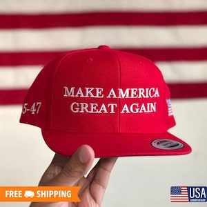 May include: Red baseball cap with white embroidery that reads "Make America Great Again".