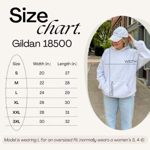 May include: A light gray Gildan 18500 hoodie with a size chart. The chart shows measurements in inches for sizes S to 3XL. The model is wearing a size L for an oversized fit. The hoodie has a front pocket and a hood.
