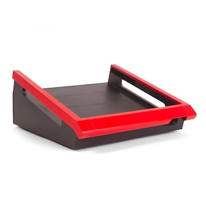 May include: A black and red angled shelf with a flat surface. The shelf has a red trim around the edges and a cutout handle on the side.