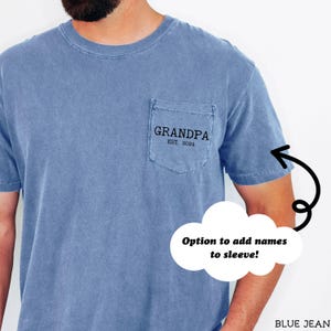 May include: A blue t-shirt with a pocket that says "Grandpa Est. 2024". There is an option to add names to the sleeve.