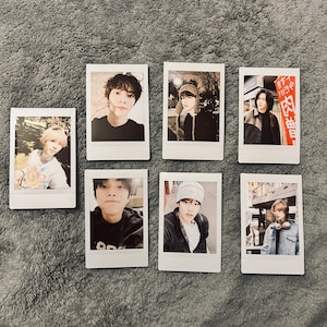 May include: A collection of ten Polaroid style photos featuring various people. The photos are arranged in two rows of five. The photos are all in color and have a vintage feel.