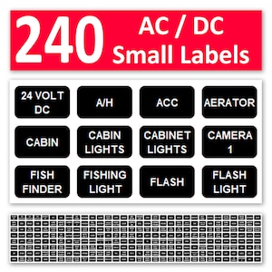 May include: A set of 240 black and white labels for AC/DC switches. The labels are small and rectangular, with white text on a black background. The labels include common switch names such as "Cabin Lights", "Flash Light", and "Fish Finder".