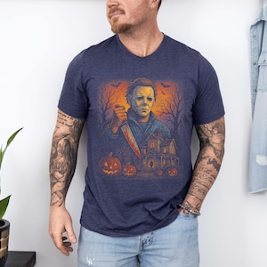 Step into the spooky season with this vintage-style Michael Myers shirt or sweatshirt. Perfect for Halloween night, horror movie parties, and fans of classic slasher films. Features a retro horror graphic that’s both eerie and stylish—ideal for scary movie lovers.