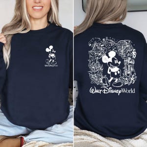 Mickey sketch sweatshirt inspired by Walt Disney World style. Cozy unisex crewneck sweatshirt perfect for Disney World vacation outfits and family matching looks. Soft and comfortable Disney trip sweatshirt ideal for park days, travel, or casual wear. Minimal sketch Mickey design makes this sweatshirt perfect for couples, families, or group Disney vacations. Cute and timeless Disney park apparel.