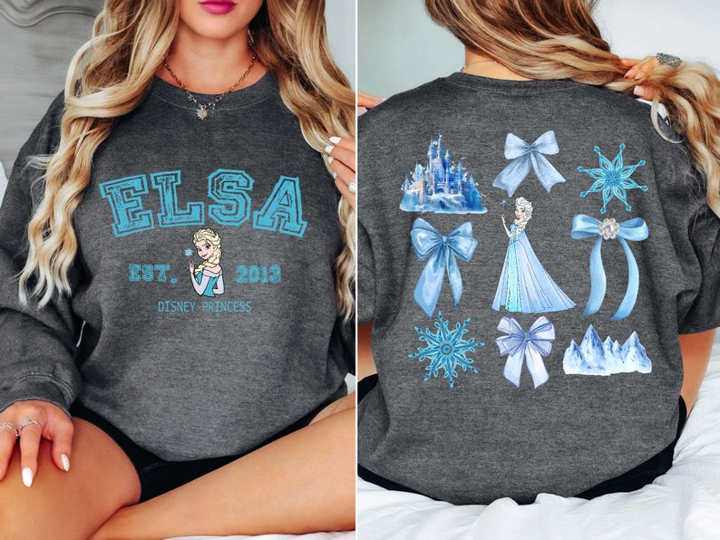 Elsa two sided bow sweatshirt and hoodie inspired by Frozen Disney princess style. Cozy unisex crewneck sweatshirt featuring front and back bow design aesthetic. Perfect Disney girls trip sweatshirt for Disneyland and Disney World vacations. Soft and comfortable Disney sweatshirt ideal for park outfits, travel days, or casual wear. Cute coquette Elsa sweatshirt great for girls, friends, and Disney fans.