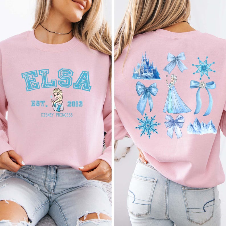 Elsa two sided bow sweatshirt and hoodie inspired by Frozen Disney princess style. Cozy unisex crewneck sweatshirt featuring front and back bow design aesthetic. Perfect Disney girls trip sweatshirt for Disneyland and Disney World vacations. Soft and comfortable Disney sweatshirt ideal for park outfits, travel days, or casual wear. Cute coquette Elsa sweatshirt great for girls, friends, and Disney fans.