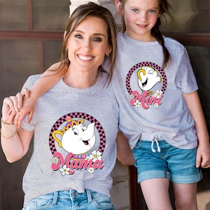 May include: Matching gray t-shirts with a cartoon teapot character. The adult shirt says "Mama" and the child's shirt says "Mini".