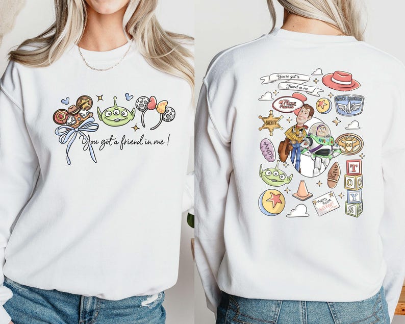 Disney Pixar Toy Story sweatshirt and hoodie featuring Woody, Buzz Lightyear, Rex, Hamm and Pizza Planet inspired design. Cozy unisex crewneck sweatshirt perfect for Disney park trips, Pixar fans, and family matching outfits. Soft and comfortable Disney sweatshirt ideal for Disneyland or Disney World vacations, travel days, or casual wear. Fun Toy Story sweatshirt great for kids at heart and Disney lovers.