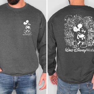 Mickey sketch sweatshirt inspired by Walt Disney World style. Cozy unisex crewneck sweatshirt perfect for Disney World vacation outfits and family matching looks. Soft and comfortable Disney trip sweatshirt ideal for park days, travel, or casual wear. Minimal sketch Mickey design makes this sweatshirt perfect for couples, families, or group Disney vacations. Cute and timeless Disney park apparel.