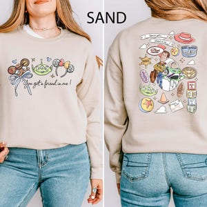 Disney Pixar Toy Story sweatshirt and hoodie featuring Woody, Buzz Lightyear, Rex, Hamm and Pizza Planet inspired design. Cozy unisex crewneck sweatshirt perfect for Disney park trips, Pixar fans, and family matching outfits. Soft and comfortable Disney sweatshirt ideal for Disneyland or Disney World vacations, travel days, or casual wear. Fun Toy Story sweatshirt great for kids at heart and Disney lovers.