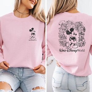 Mickey sketch sweatshirt inspired by Walt Disney World style. Cozy unisex crewneck sweatshirt perfect for Disney World vacation outfits and family matching looks. Soft and comfortable Disney trip sweatshirt ideal for park days, travel, or casual wear. Minimal sketch Mickey design makes this sweatshirt perfect for couples, families, or group Disney vacations. Cute and timeless Disney park apparel.