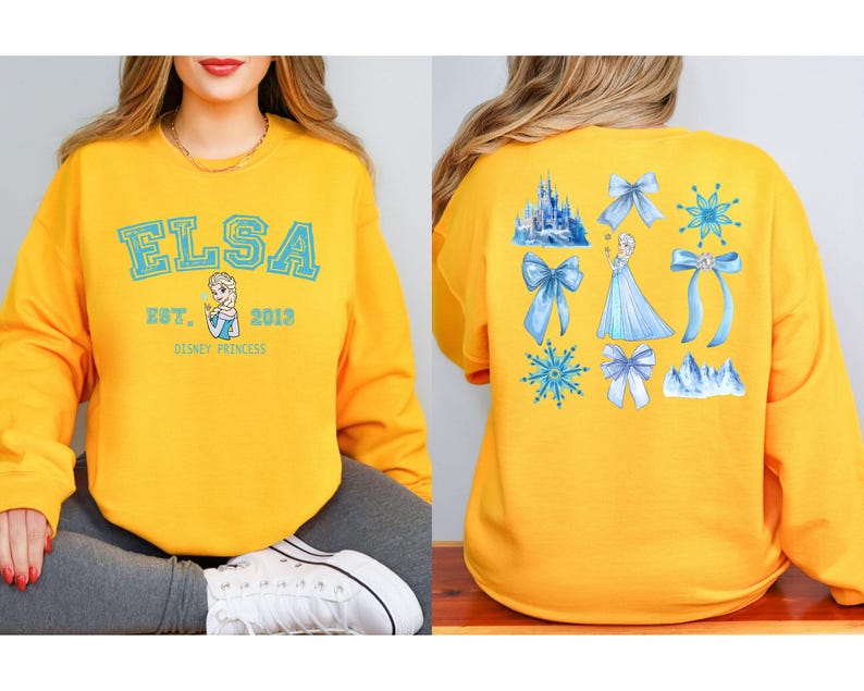 Elsa two sided bow sweatshirt and hoodie inspired by Frozen Disney princess style. Cozy unisex crewneck sweatshirt featuring front and back bow design aesthetic. Perfect Disney girls trip sweatshirt for Disneyland and Disney World vacations. Soft and comfortable Disney sweatshirt ideal for park outfits, travel days, or casual wear. Cute coquette Elsa sweatshirt great for girls, friends, and Disney fans.