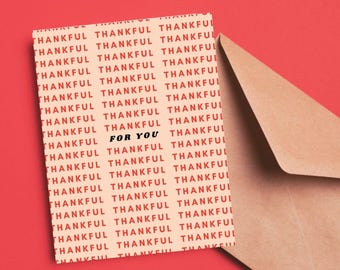 May include: A peach-colored card with the words "THANKFUL" repeated in red text. The words "FOR YOU" are centered in black text.