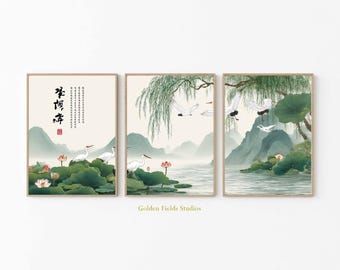 May include: A triptych of framed art prints showcasing an Asian-inspired landscape. The prints feature white cranes, lotus flowers, and mountains. The artwork includes Chinese calligraphy and is in shades of green, beige, and brown.