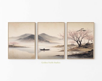 May include: Set of three framed art prints depicting a serene Asian landscape. The artwork features misty mountains, a calm lake, and cherry blossom trees. A small boat with a figure is on the water. The prints have a neutral color palette with soft, muted tones.