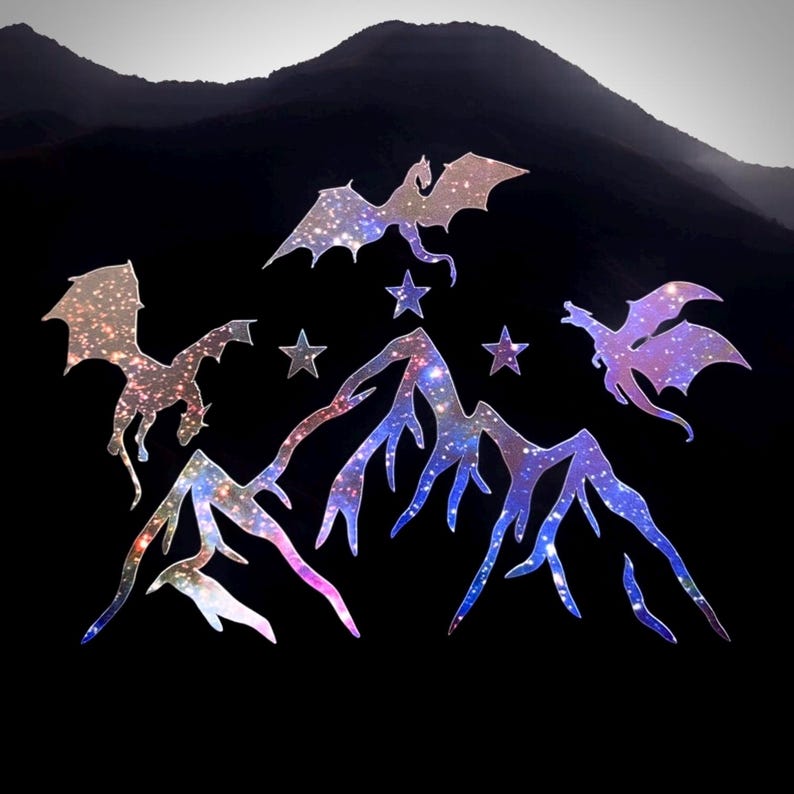 May include: Three dragons with a galaxy pattern fly over a mountain range with a galaxy pattern.  The dragons are silhouetted against a black background.  There are five stars in the sky.