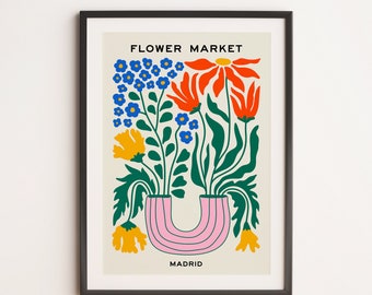 May include: A colourful illustration of flowers in a pink vase with the text "FLOWER MARKET MADRID".