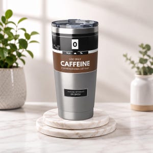 May include: A stainless steel tumbler with a clear lid, featuring a brown and black label that reads USE ONLY CAFFEINE FOR PROFESSIONAL USE ONLY and IF FOUND, RETURN TO DR SMITH, with a volume percentage graphic at the top of the design.