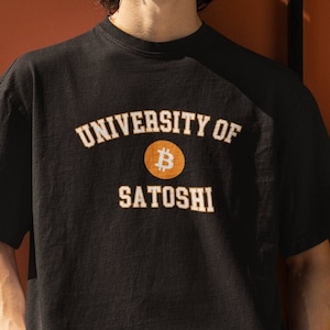 May include: A black t-shirt with a white and orange graphic print that says "University of Satoshi" with a Bitcoin symbol.