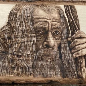 8.5 x 11in print of Gandalf at Irthanc in Isengard when he is talking to Saruman and finds out the nine are heading to the Shire