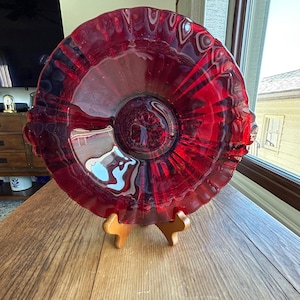 May include: A white ceramic mug with a black handle and the text "But First, Coffee" in a black, handwritten-style font. The mug is likely 11-15 ounces in size, perfect for a morning beverage.