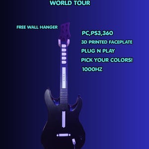 May include: A black guitar-shaped game controller with a white neck and buttons. Text reads: WORLD TOUR, FREE WALL HANGER, PC, PS3, 360, 3D PRINTED FACEPLATE, PLUG N PLAY, PICK YOUR COLORS, 1000HZ. The controller features a long neck and a solid body.