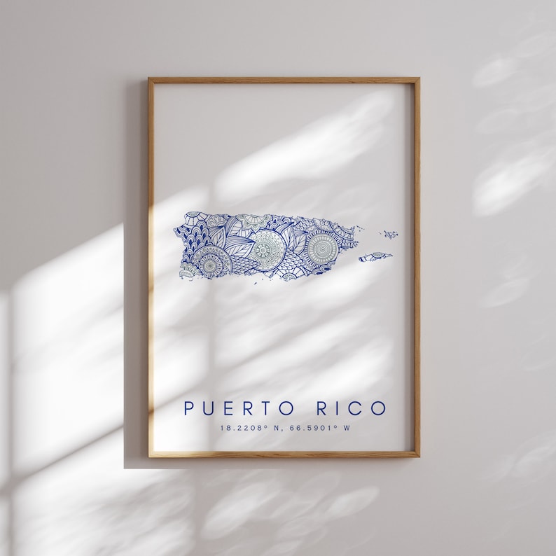 May include: A printable art print featuring a blue and white mandala design of the island of Puerto Rico. The print includes the text "Puerto Rico" and the coordinates "18.2208&deg; N, 66.5901&deg; W".
