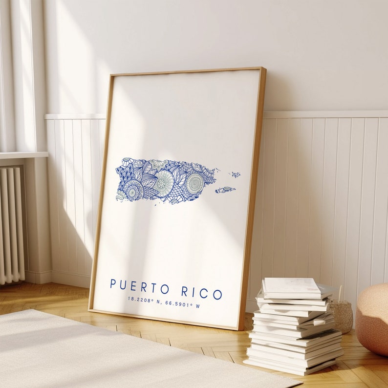 May include: A framed print of a blue and white patterned map of Puerto Rico. The print includes the text "Puerto Rico" and the coordinates "18.2208&deg; N, 66.5901&deg; W".