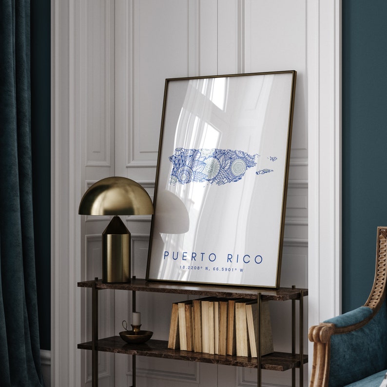 May include: A framed print of a blue and white map of Puerto Rico with the text "PUERTO RICO 18.2208&deg; N, 66.5901&deg; W" at the bottom.