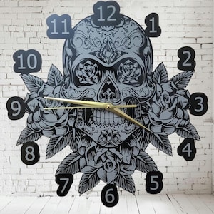 May include: Black and white wall clock featuring a sugar skull design with roses. The clock face has Roman numeral hour markers.