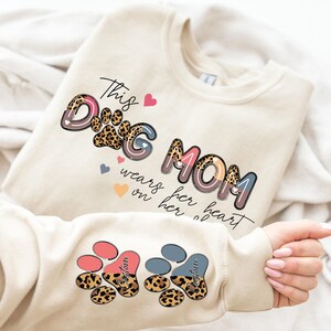 This Dog Mom Wears Her Heart on Her Sleeve Sweatshirt Dog Paw Sweatshirt,Custom Dog Name Sweatshirt,Gift For Dog Mama,Dog Mom Gift,Pet Lover