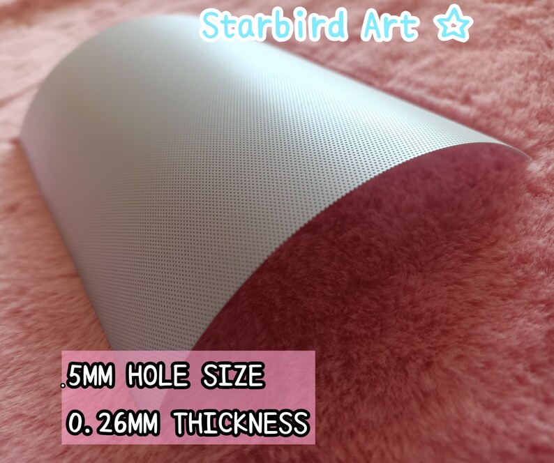 May include: A sheet of gray perforated material with a curved shape. The text on the image reads: .5MM HOLE SIZE, 0.26MM THICKNESS. The material is on a pink, fuzzy surface. The top right corner has the text "Starbird Art".
