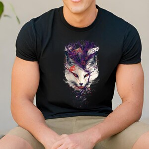 May include: Black t-shirt with a white fox head graphic. The fox is surrounded by purple and red abstract shapes.