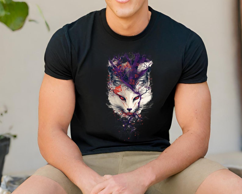 May include: Black t-shirt with a white fox head graphic. The fox is surrounded by purple and red abstract shapes.