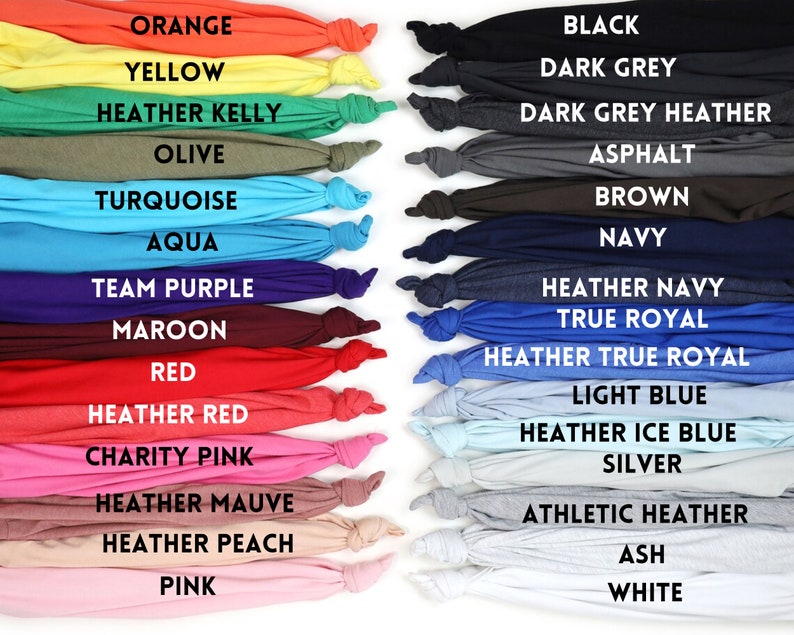 May include: A color chart of 20 different t-shirt colors, including orange, yellow, olive, turquoise, aqua, team purple, maroon, red, heather red, charity pink, heather mauve, heather peach, pink, black, dark grey, dark grey heather, asphalt, brown, navy, heather navy, true royal, heather true royal, light blue, heather ice blue, silver, athletic heather, ash, and white.