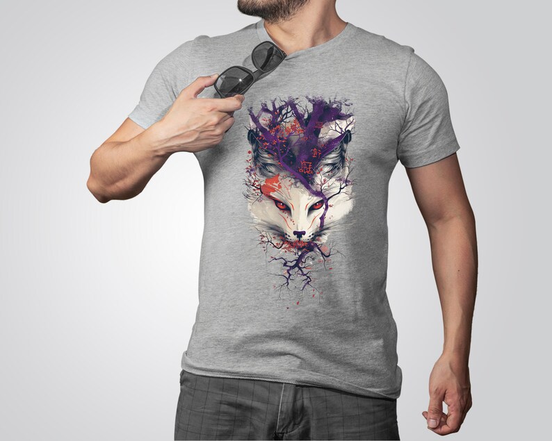 May include: A gray t-shirt with a graphic print of a white fox's face surrounded by purple and red branches.