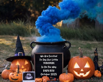 May include: A Halloween-themed gender reveal announcement with a black cauldron, pumpkins, and a blue smoke bomb. The sign reads "We Are Excited To Say Our Little PUMPKIN Is On The Way BABY BOY October 2025".