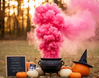 May include: A gender reveal scene featuring a black cauldron with a plume of pink smoke. Pumpkins of different sizes and colours are arranged around the cauldron. A sign reads "WE'RE EXCITED TO SAY OUR LITTLE PUMPKIN IS ON THE WAY BABY GIRL APRIL 2028."
