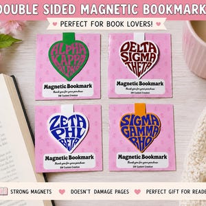 May include: Four double-sided magnetic bookmarks with heart-shaped designs, each featuring Greek letters in various colours. The bookmarks are on pink cards with the text "Magnetic Bookmark." The image also includes the text "Double Sided Magnetic Bookmarks" and "Perfect for Book Lovers!"