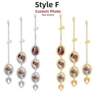 May include: Six hanging ornaments labeled Style F Custom Photo Year Charm. Three are silver-toned and three are gold-toned. Each features a chain, a 2026 year charm, oval frames containing photographs of people, and a pair of angel wings at the bottom.