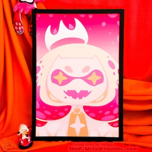 May include: A framed print of a pink and white cartoon character with a crown and large eyes. The character has a pink and white spotted pattern on its body. The background is a gradient of pink and white.