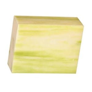 May include: A rectangular block of soap with a light green and white marbled design. The soap has a smooth surface and a slightly angled edge, giving it a modern look. The color palette is soft and natural.