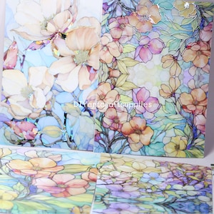 May include: Close-up of floral art prints featuring watercolor-style flowers in shades of peach, pink, and yellow, with green leaves. The prints have a stained-glass effect, with the text "DIYartcraftsupplies" visible.