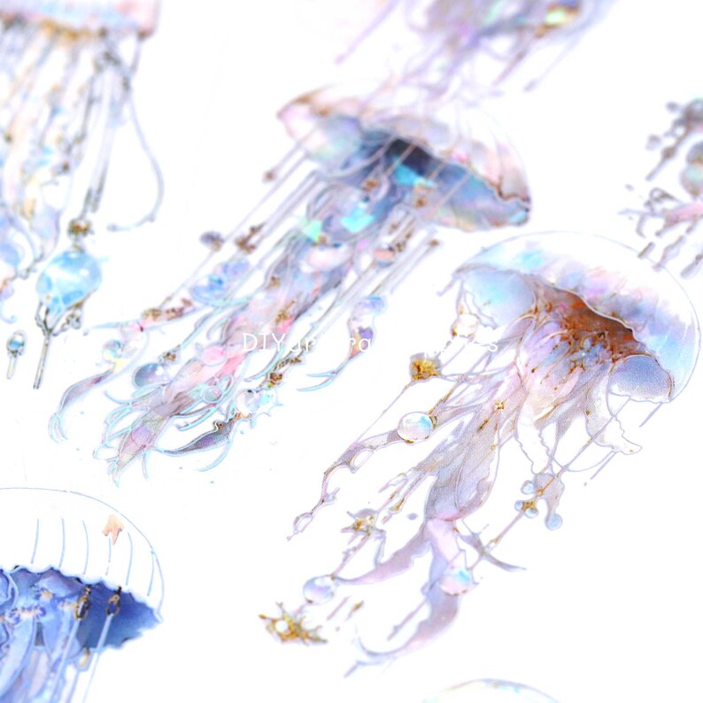 May include: A sheet of iridescent holographic stickers featuring jellyfish with intricate details. The jellyfish are translucent with a pearlescent finish and have delicate tentacles.