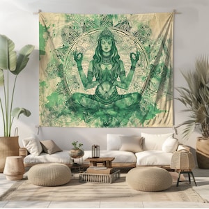 May include: A green and white tapestry featuring a woman meditating in a lotus position. The woman is surrounded by a mandala design with intricate details. The tapestry has a watercolor effect, giving it a soft and ethereal look.